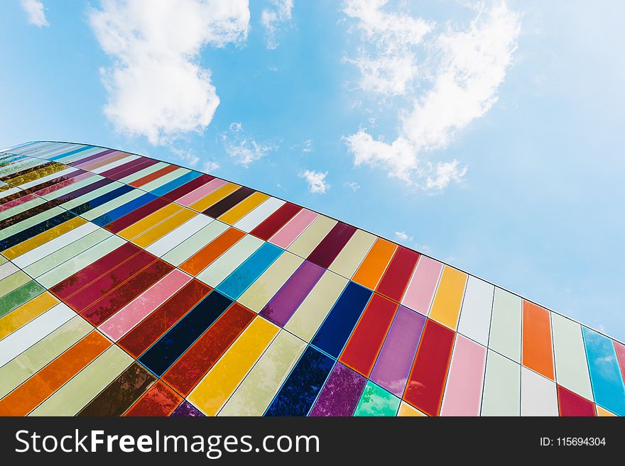 Low Angle Of Colorful Glass Panels Under Blue Sky