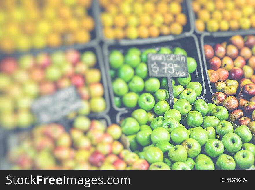 Market stall with tropical fruits and vegetables.