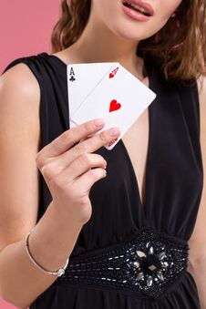 Beautiful Caucasian Woman With Poker Cards Gambling In Casino. Studio Shot Stock Photo