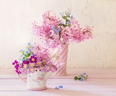 Spring Flowers In Vases On Wooden Table Royalty Free Stock Photography Spring Flowers In Vases On Wooden Table Royalty Free Stock Photography