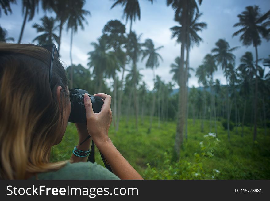 Woman Holding Dslr Camera Taking Photo