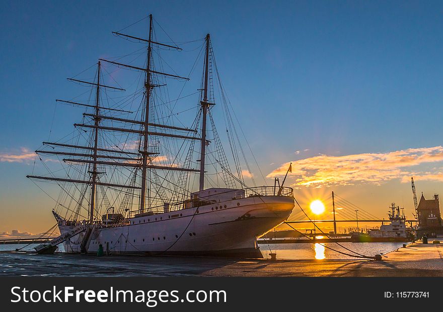 White Ship In Dock During Golden Hour