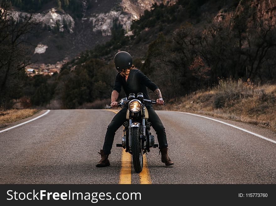 Man Riding Boxer Motorcycle on Road