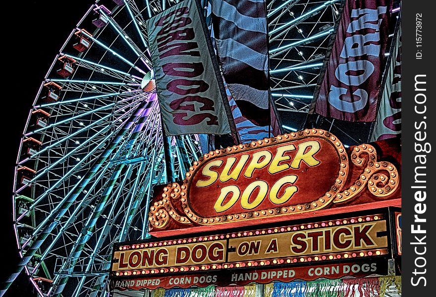 Super Dog Hot Dog Food Stall in Front of Ferris Wheel during Nighttime