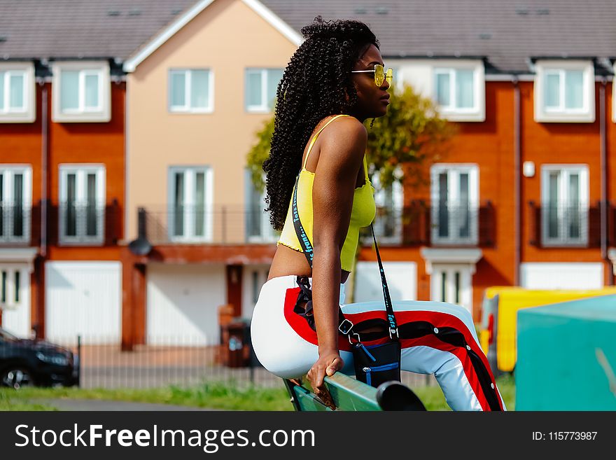 Woman Wearing Yellow Cami Crop-top