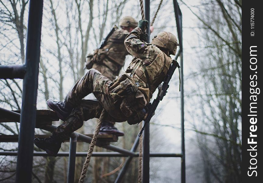 Soldier Climbing on Rope