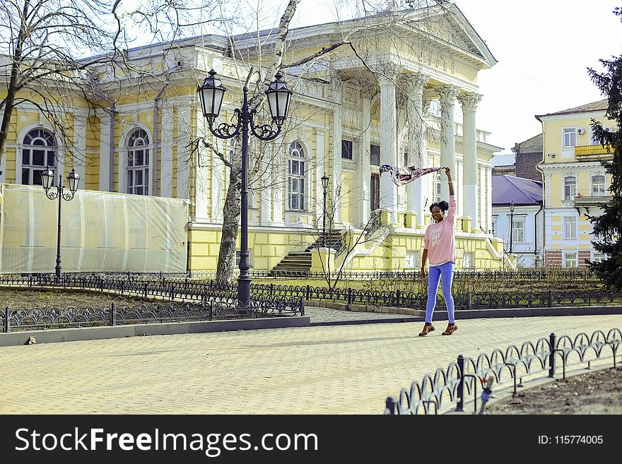 Girl Wearing Pink Long-sleeved Shirt And Blue Pants At Street