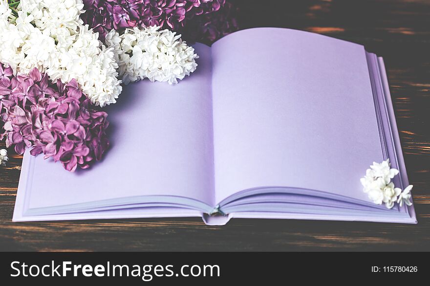 Lilac flowers and notebook