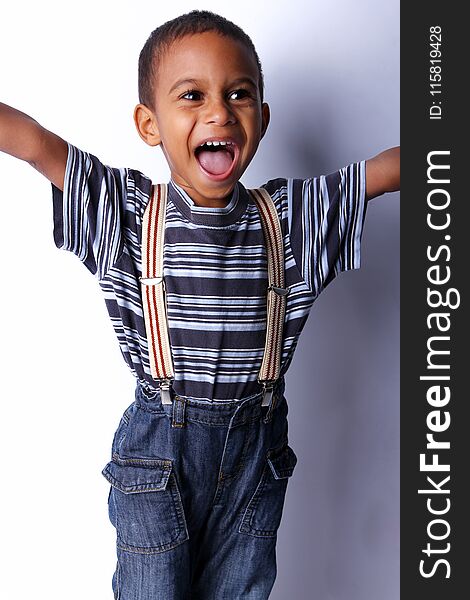 Happy cute black african child in studio. Happy cute black african child in studio.