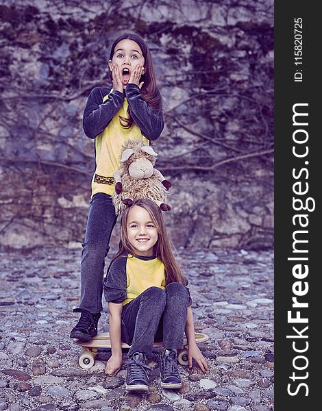 Two Cute Females Teenager In Yellow T Shirt.