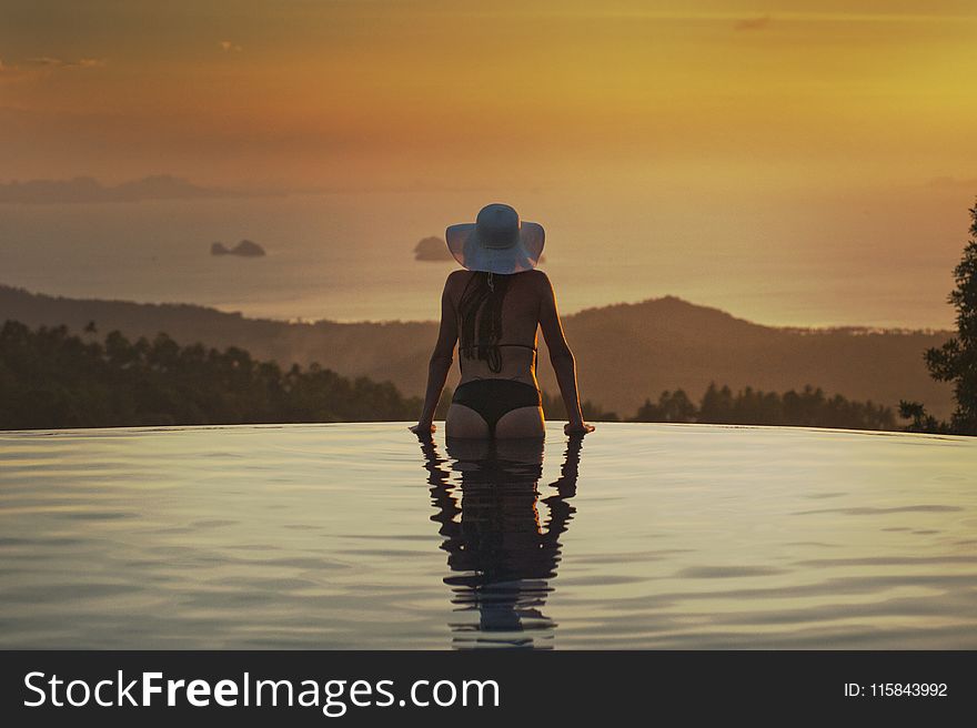 Woman At The Edge Of The Pool