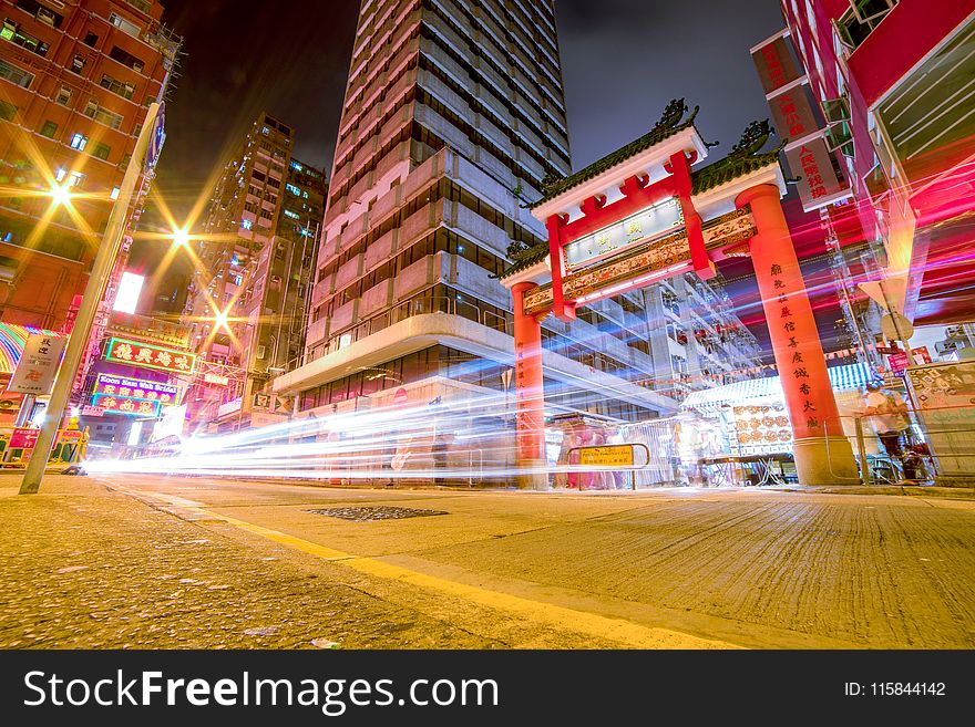 Time Lapse Photography Of Vehicles Passing Through China Town