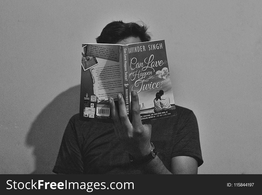 Grayscale Photography Of Man Reading Book