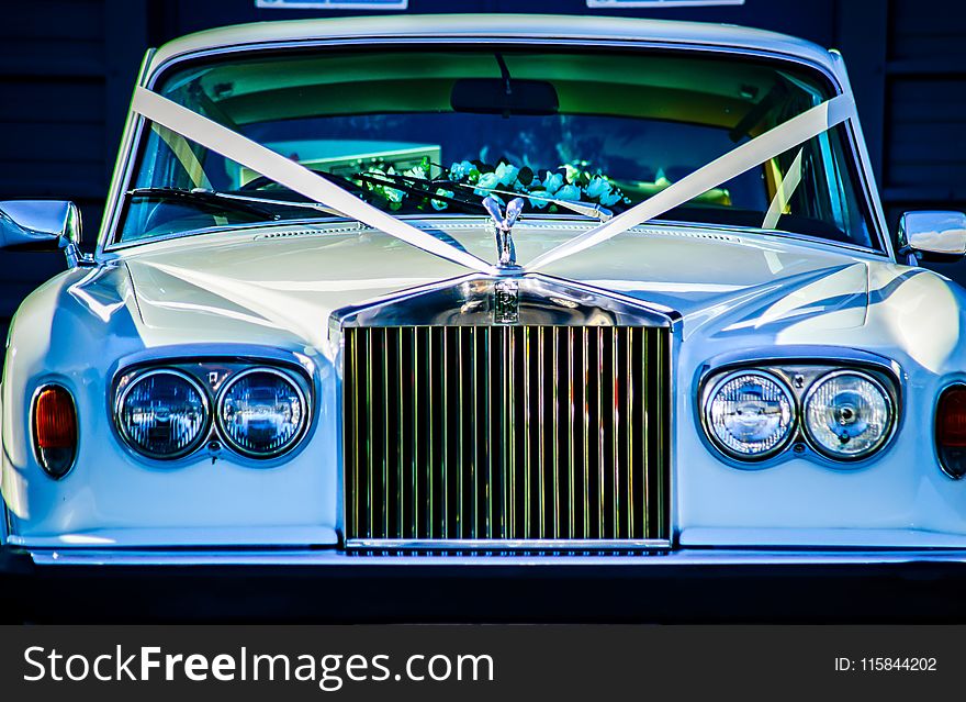 Closeup Photo of White Rolls Royce Vehicle