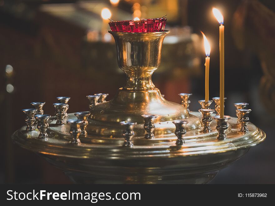 Metal candle light cresset in church. Metal candle light cresset in church.