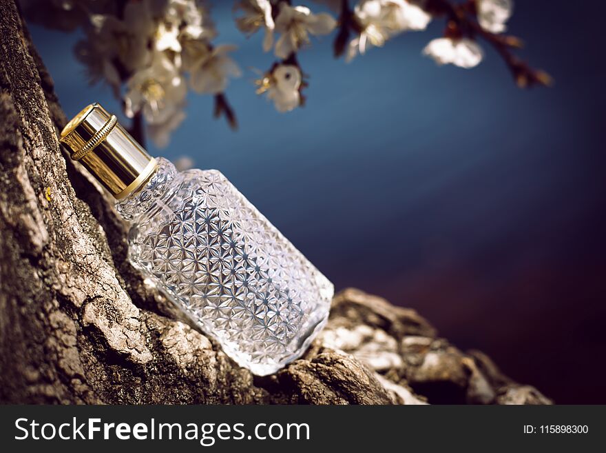 Female perfume with flowers on nature background. Female perfume with flowers on nature background