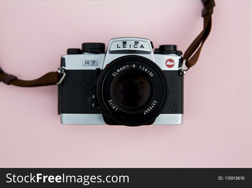 Black and Grey Leica Camera on Pink Background
