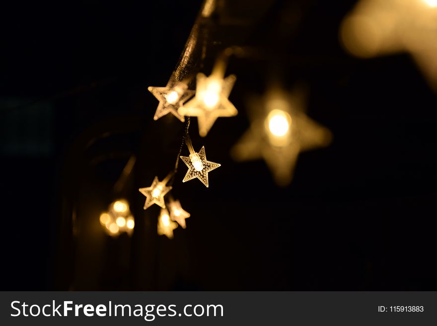 Shallow Focus Photography Of Yellow Star Lanterns