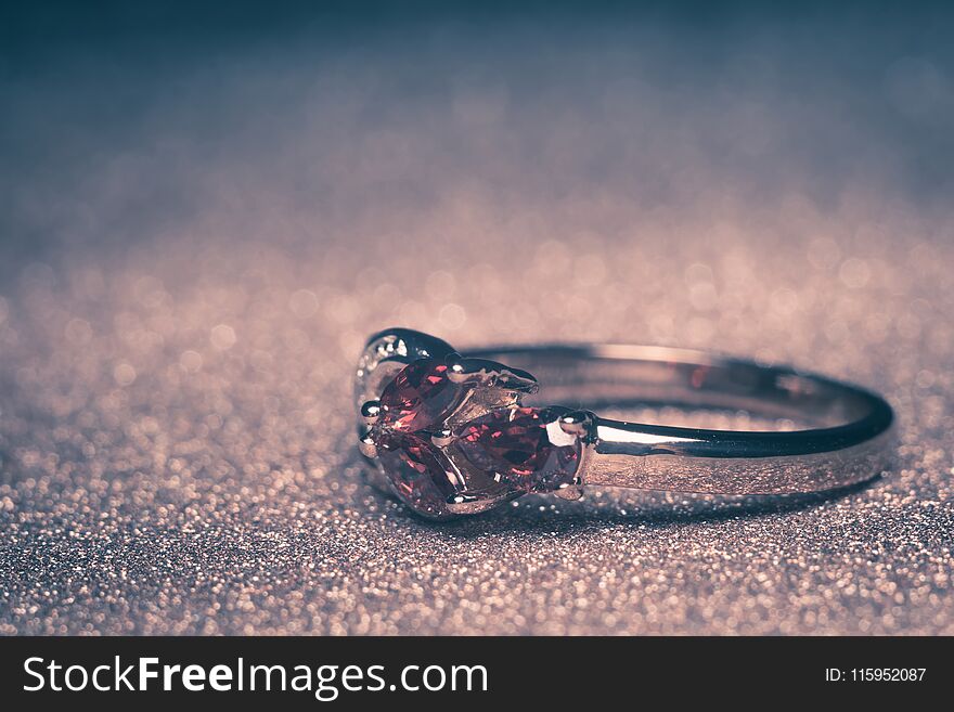 Precious golden ring with red stone, garnet or zircon. Precious golden ring with red stone, garnet or zircon.