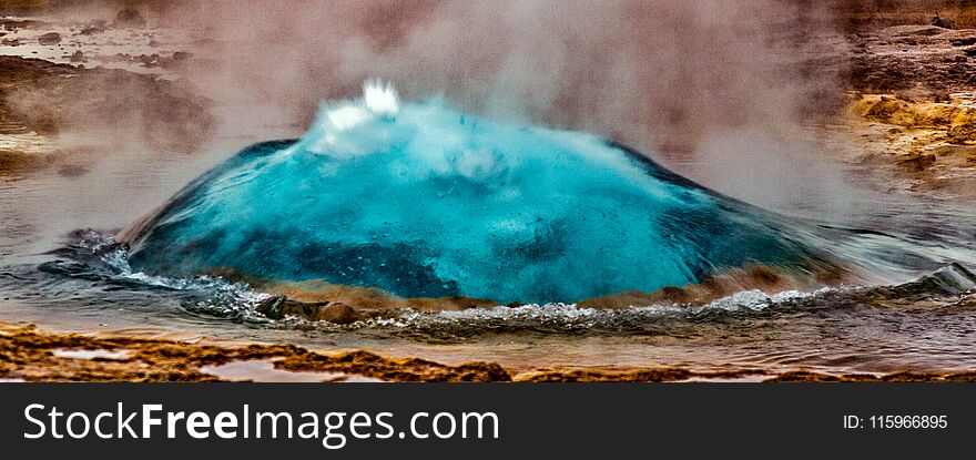 Geyser in Iceland begins eruption by first forming a bubble of hot water, before bursting into the air. Geyser in Iceland begins eruption by first forming a bubble of hot water, before bursting into the air