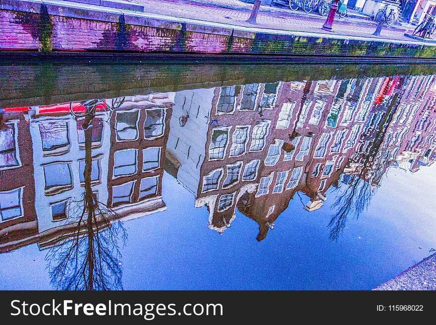 Houses reflected in Amsterdam canal