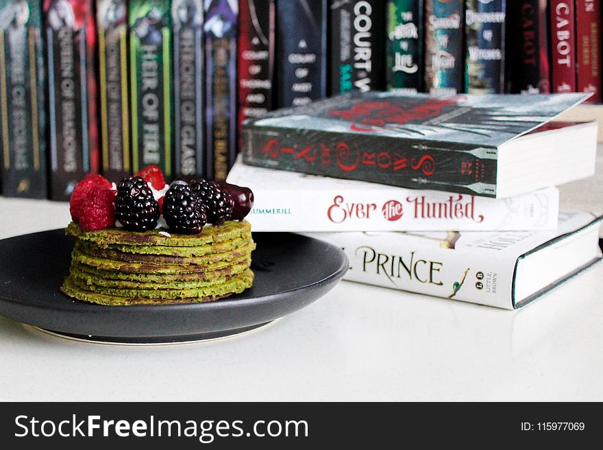 Books Near Cake on Plate