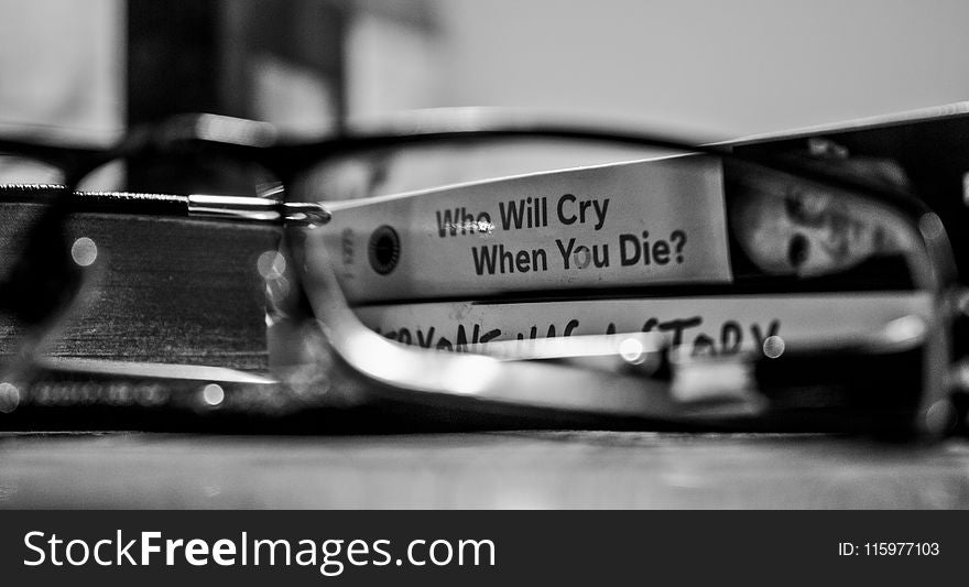 Grayscale Photography View Through Eyeglasses Who Will Cry When You Die Labeled Book