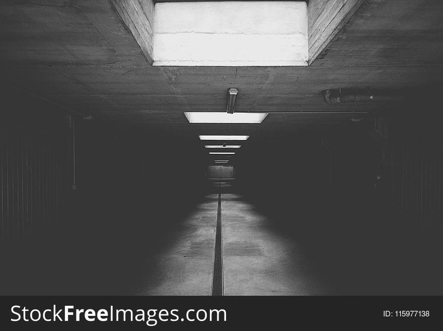 Grayscale Photo of Concrete Room