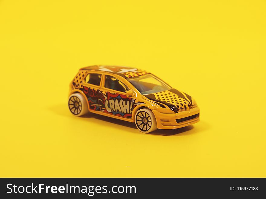 Yellow and Red 5-door Hatchback Die-cast Model