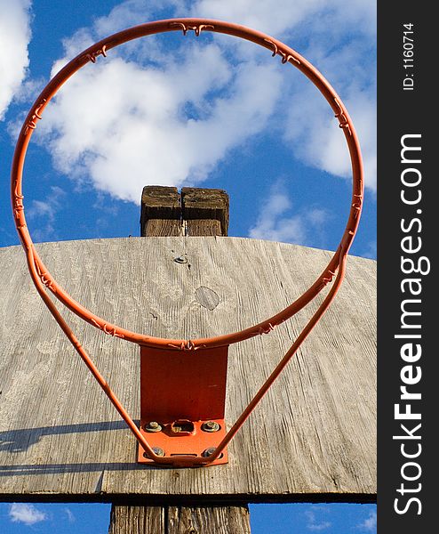 Looking up at sky through a basketball hoop. Looking up at sky through a basketball hoop