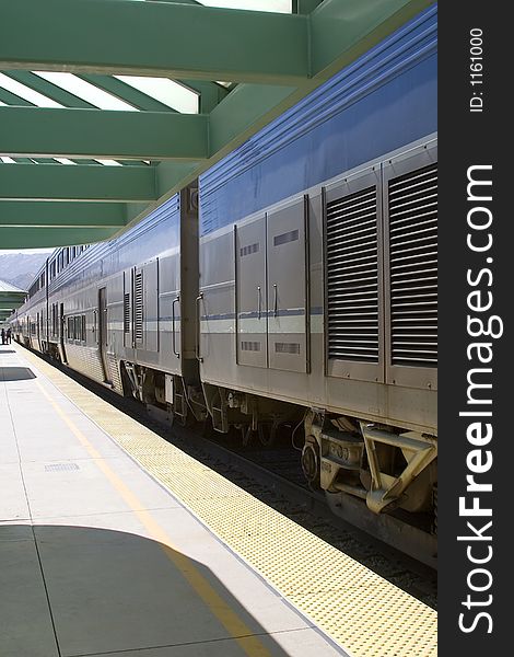 Train stopped at station to off load passengers. Train stopped at station to off load passengers.