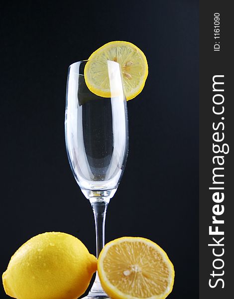 A glassy wine glass with lemon. A glassy wine glass with lemon.