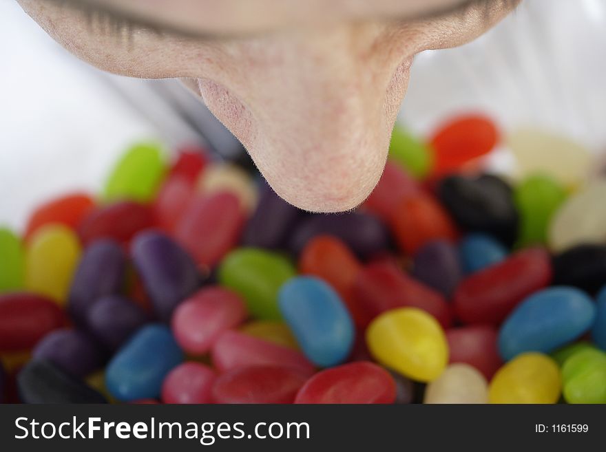 Image of a nose above a bowl of lollies. Image of a nose above a bowl of lollies
