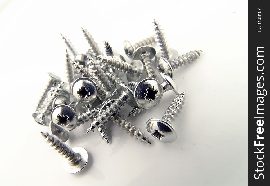 A pile of screws. A pile of screws.