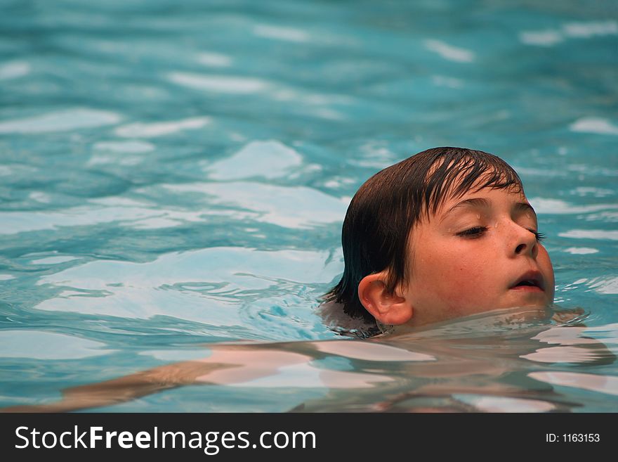 Child having fun swimming in pool. Child having fun swimming in pool