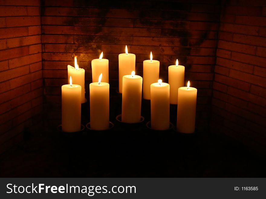 Glowing Candles in a Fireplace. Glowing Candles in a Fireplace