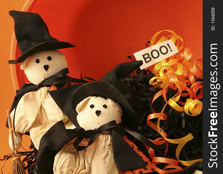 2 small cat dolls dressed as witches with black raffia, ribbon and a boo sign. 2 small cat dolls dressed as witches with black raffia, ribbon and a boo sign