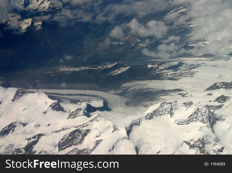 Seen from 30000 feet, a beautiful glacier in the Alps. Seen from 30000 feet, a beautiful glacier in the Alps.