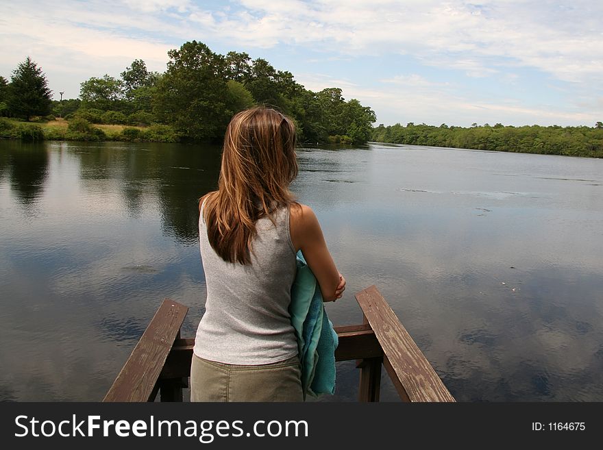 Woman looking out into Lake