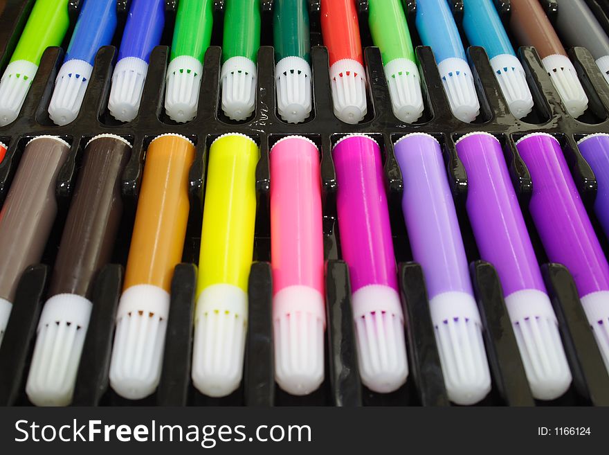 Close-up of colored marker pens on a black tray. Close-up of colored marker pens on a black tray