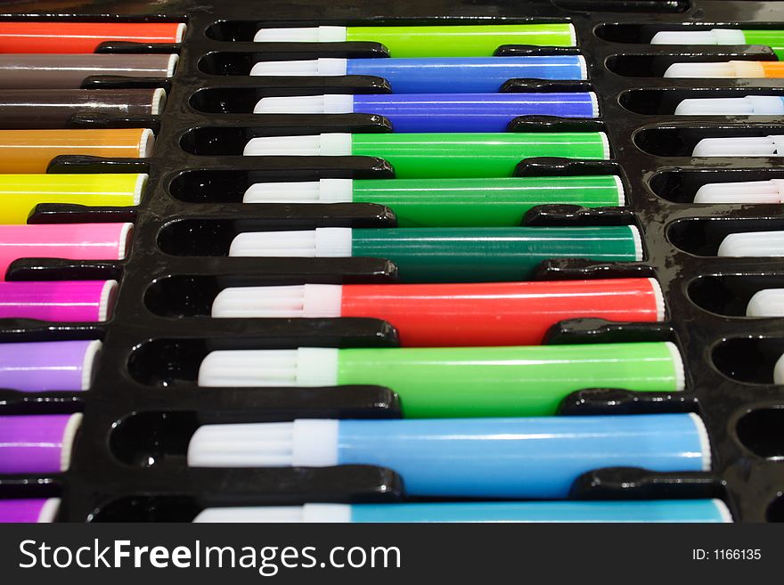 Close-up of colored marker pens on a black tray. Close-up of colored marker pens on a black tray