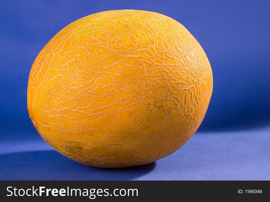 Bright colorfull melon over blue background. Bright colorfull melon over blue background