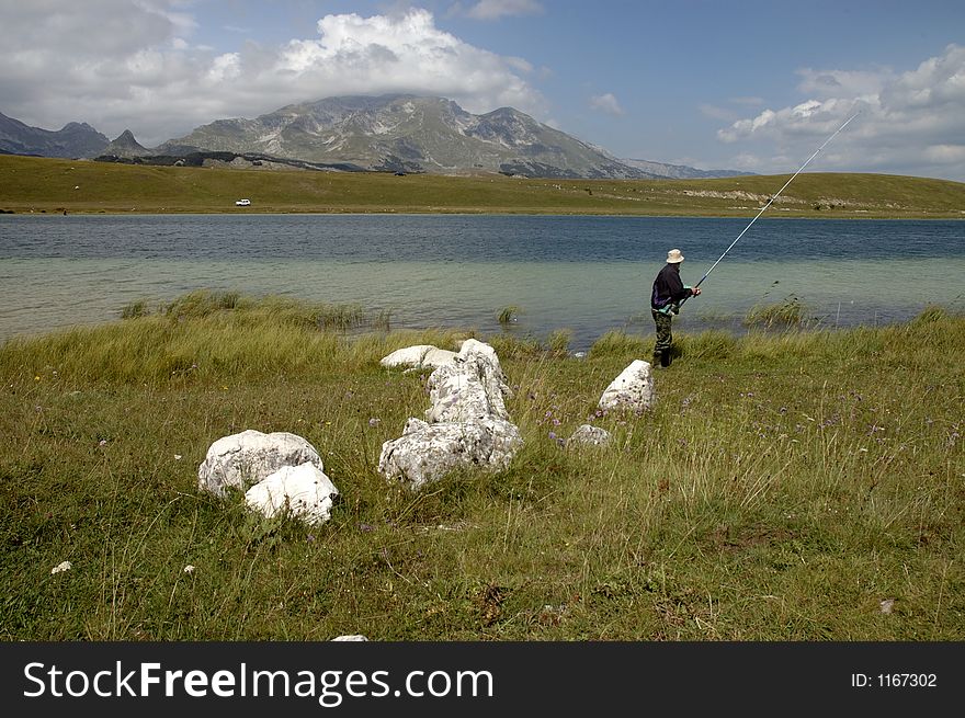 Fisherman at the lake, zabljak, montenegro. Fisherman at the lake, zabljak, montenegro
