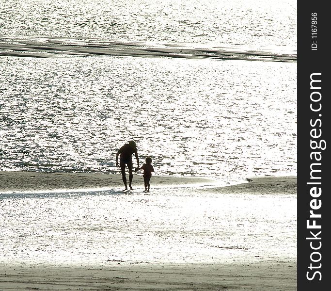 Parent with child on the beach. Parent with child on the beach