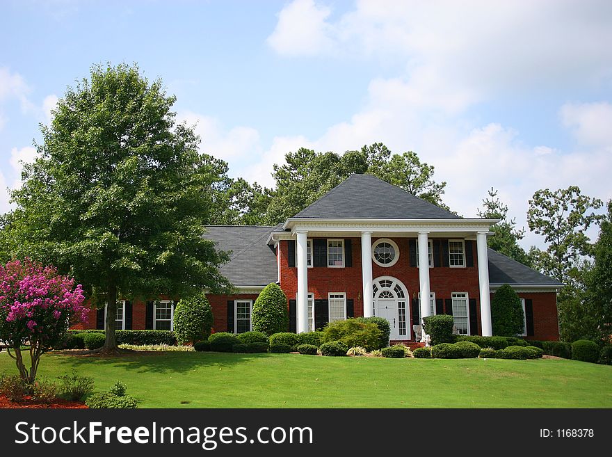 Nice brick house on street. Nice brick house on street