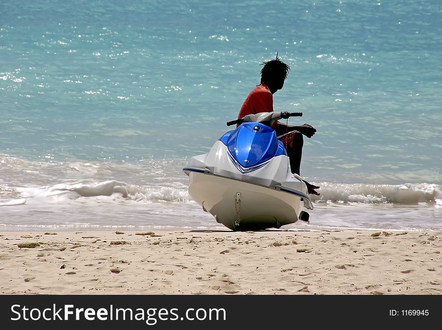 A jet ski rider taking a rest