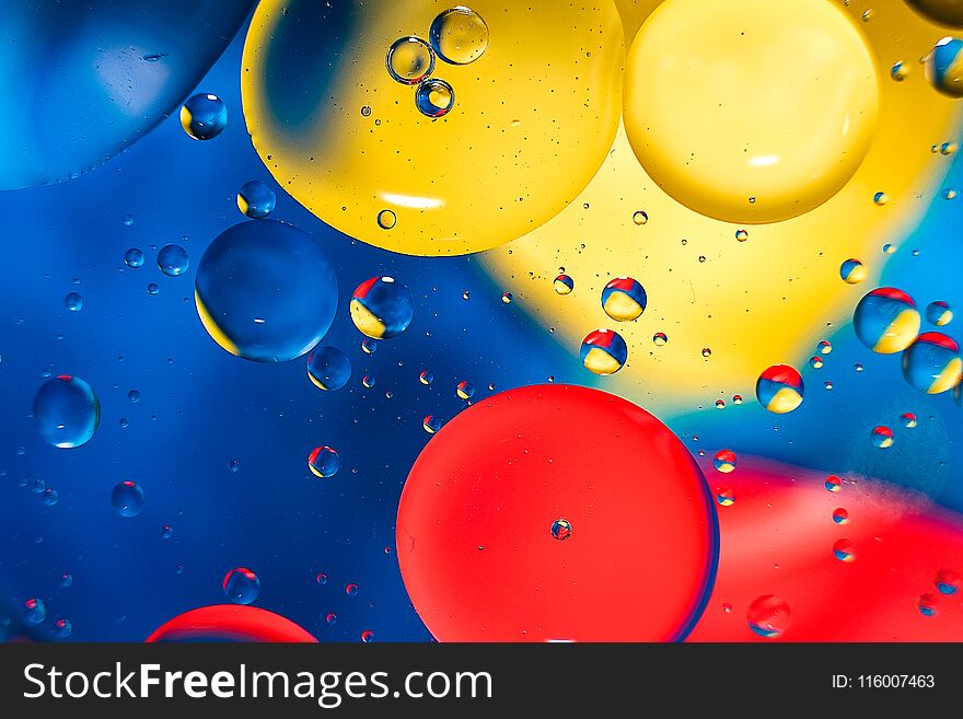 Colorful background from water drops and oil