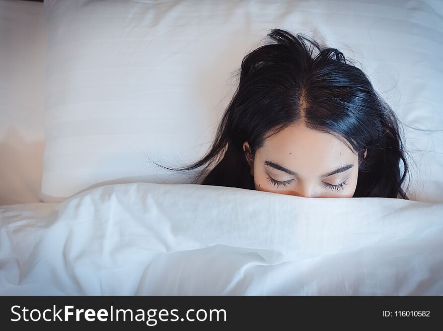 Soon to wake up for sleeping attractive asian young woman.