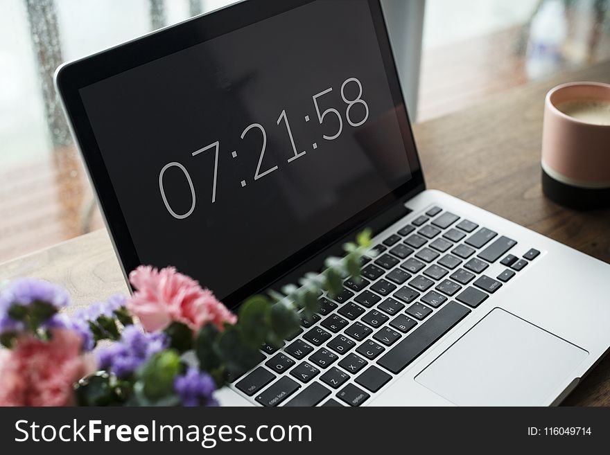 Close-Up Photography of MacBook near Flowers