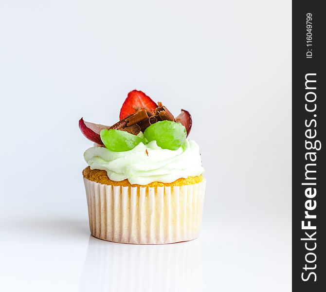 White and Yellow Cupcake With Fruit Toppings